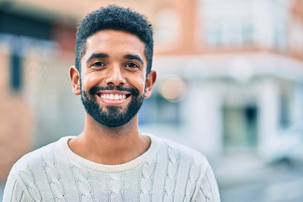 smiling man with good teeth - Retainers
